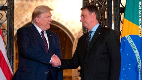 US President Donald Trump (L) shakes hands with Brazilian President Jair Bolsonaro during a diner at Mar-a-Lago in Palm Beach, Florida, on March 7, 2020. (Photo by JIM WATSON / AFP) (Photo by JIM WATSON/AFP via Getty Images)